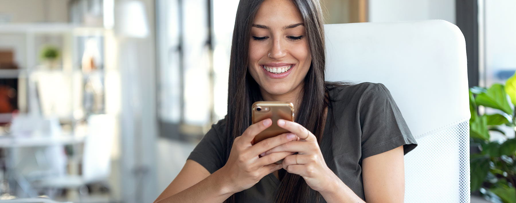 A photo of a woman using a website designed in Northwest Arkansas.