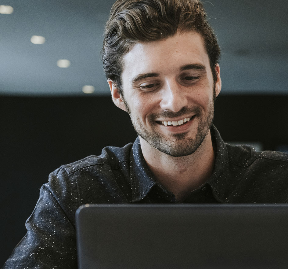 Photo of a man with a professionally managed website so he is happy and relaxed.